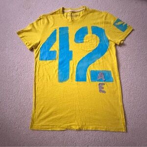 American Eagle Outfitters Yellow Tee with Blue "42" Graphic